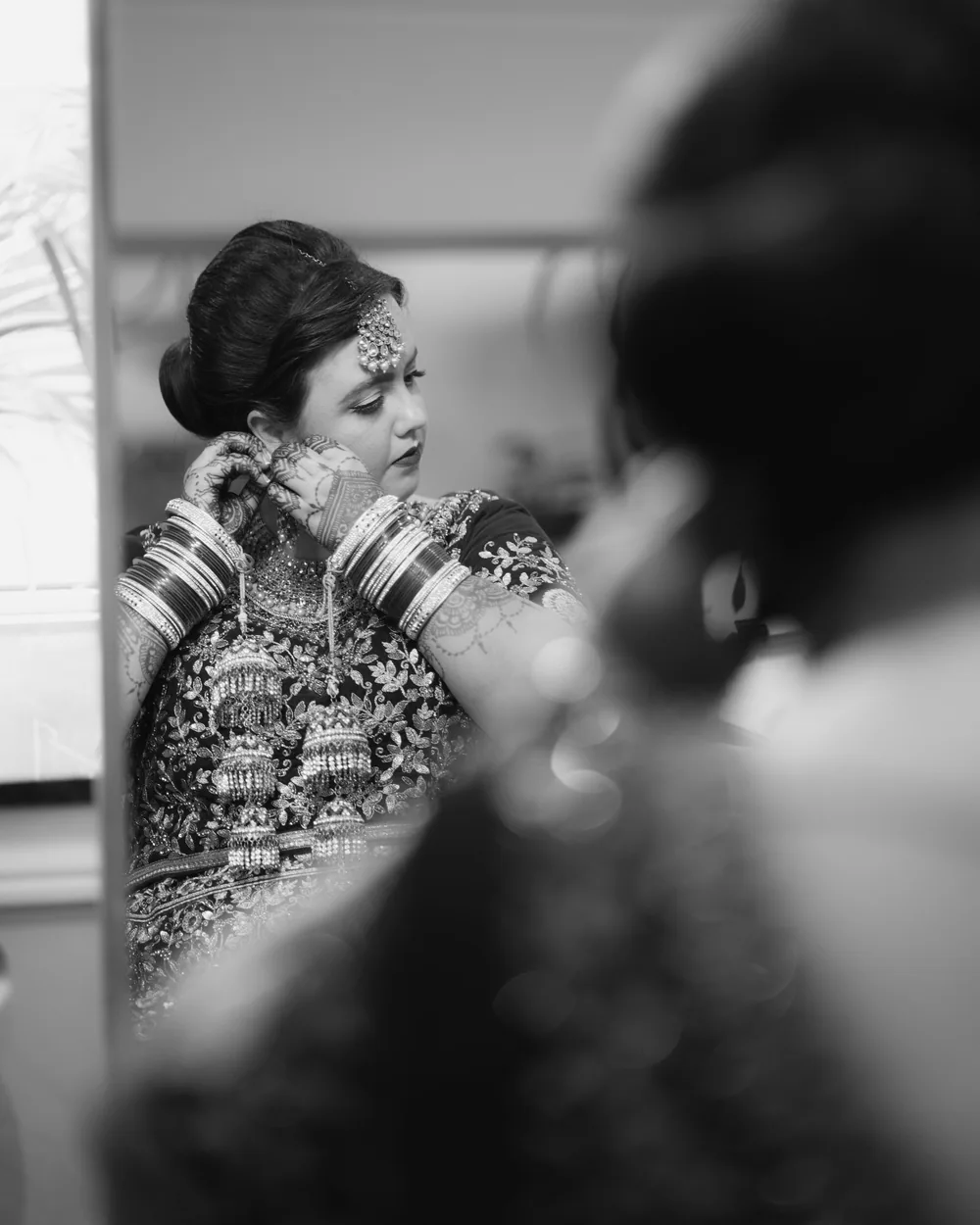 Bridal jewellery being adjusted during a styling appointment at the studio